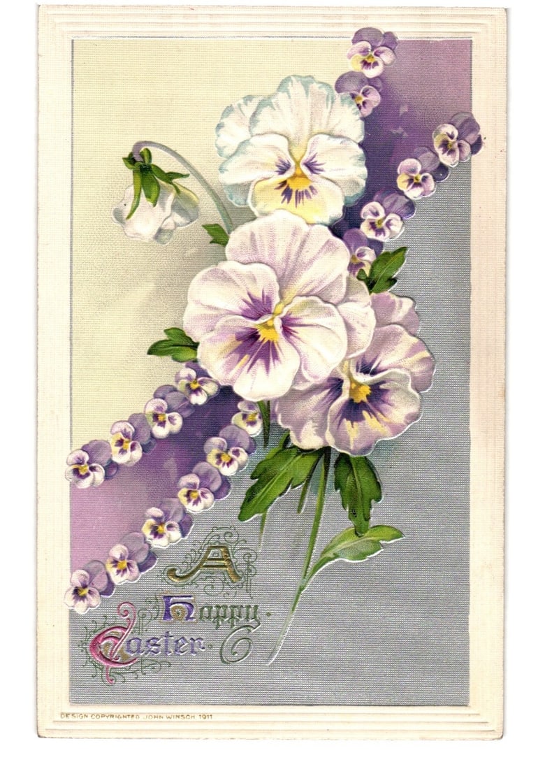 Embossed Chromolithograph Easter Postcard with Pansies, Diagonal Design, and 1911 Copyright: A vibrant floral design featuring several large, light purple and white pansies with yellow and deep purple centers, arranged along a diagonal band of smaller purple pansies. A single bell-shaped whit