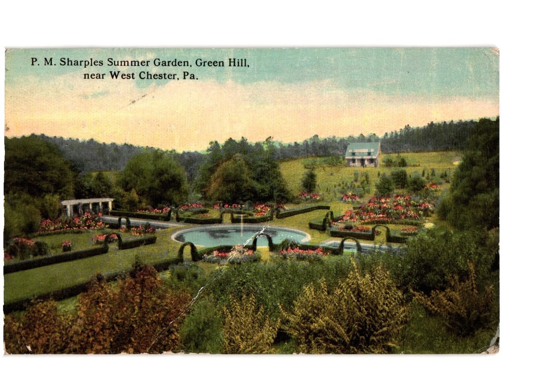 P. M. Sharples Summer Garden, Green Hill, West Chester, PA, 1916 Divided Back Postcard: A panoramic view of P. M. Sharples Summer Garden in Green Hill, near West Chester, Pennsylvania. The garden features a formal design with a central circular water feature, ornate hedges, and numerous 
