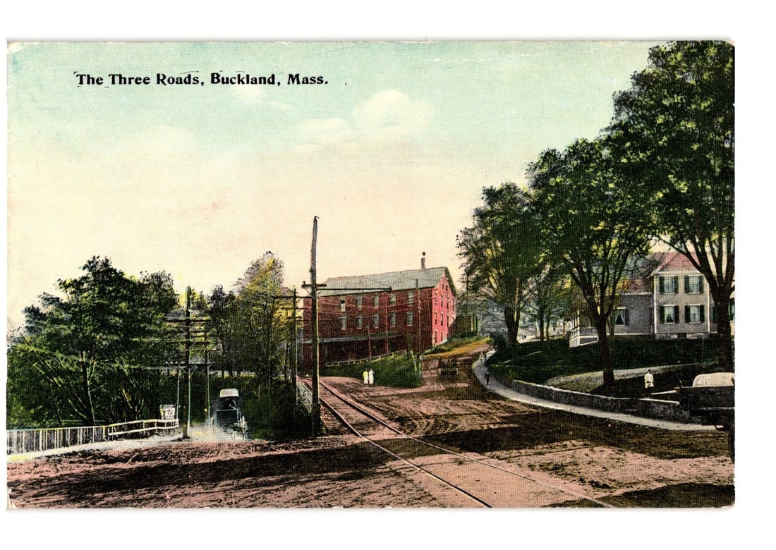 The Three Roads, Buckland, Massachusetts, early 20th century intersection postcard view.: An early 20th century photochrom postcard depicting an intersection known as The Three Roads in Buckland, Massachusetts. The image shows multiple roads converging, with what appear to be railroad trac