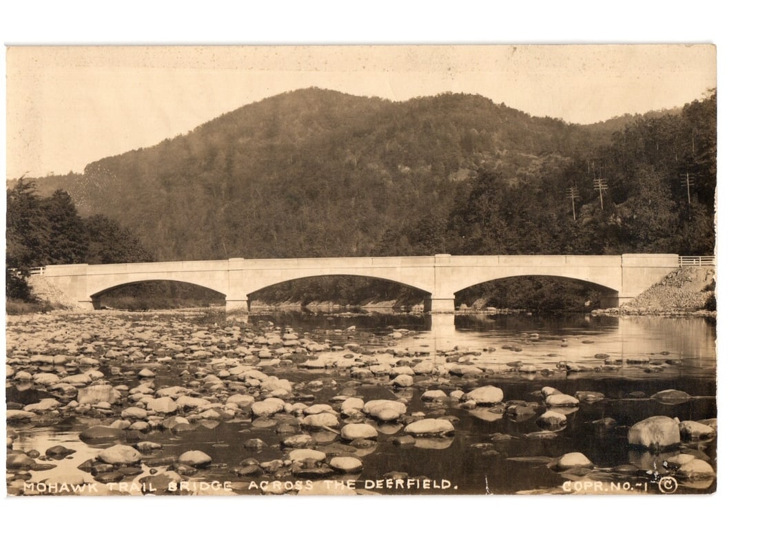 Real photo postcard of Mohawk Trail Bridge over Deerfield River with rocky bed and wooded hills. (1 of 2)
