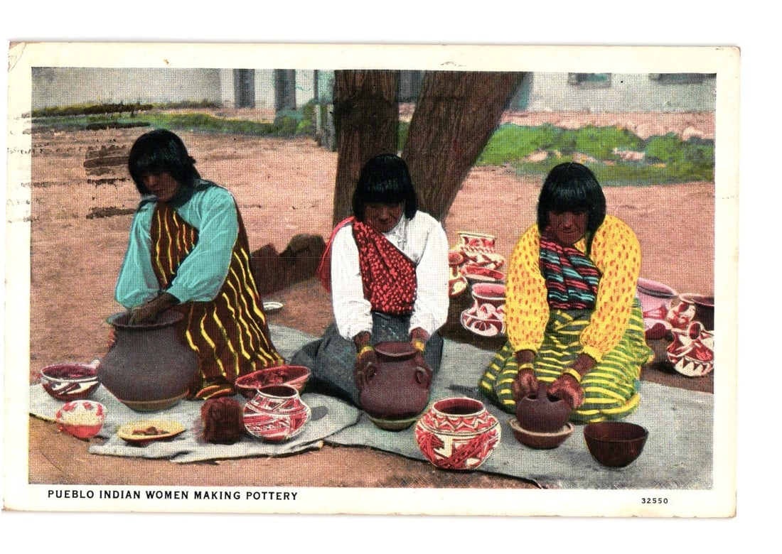 Lithographic Postcard Depicting Pueblo Indian Women Making Pottery, Southwestern U.S., 1930s.: Three Pueblo Indian women are depicted outdoors, seated on the ground, engaged in pottery making. The woman on the left, wearing a light blue top and patterned brown and yellow skirt, works on a large