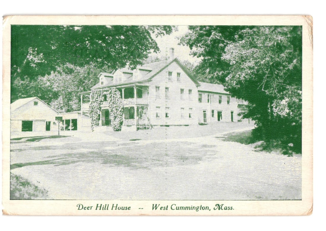 Deer Hill House, West Cummington, Massachusetts, 1941-era monochrome green postcard.: A large multi-story house, identified as Deer Hill House, is situated in a wooded setting. The house features a prominent veranda or porch on the left side, partially covered in climbing vines. A smal
