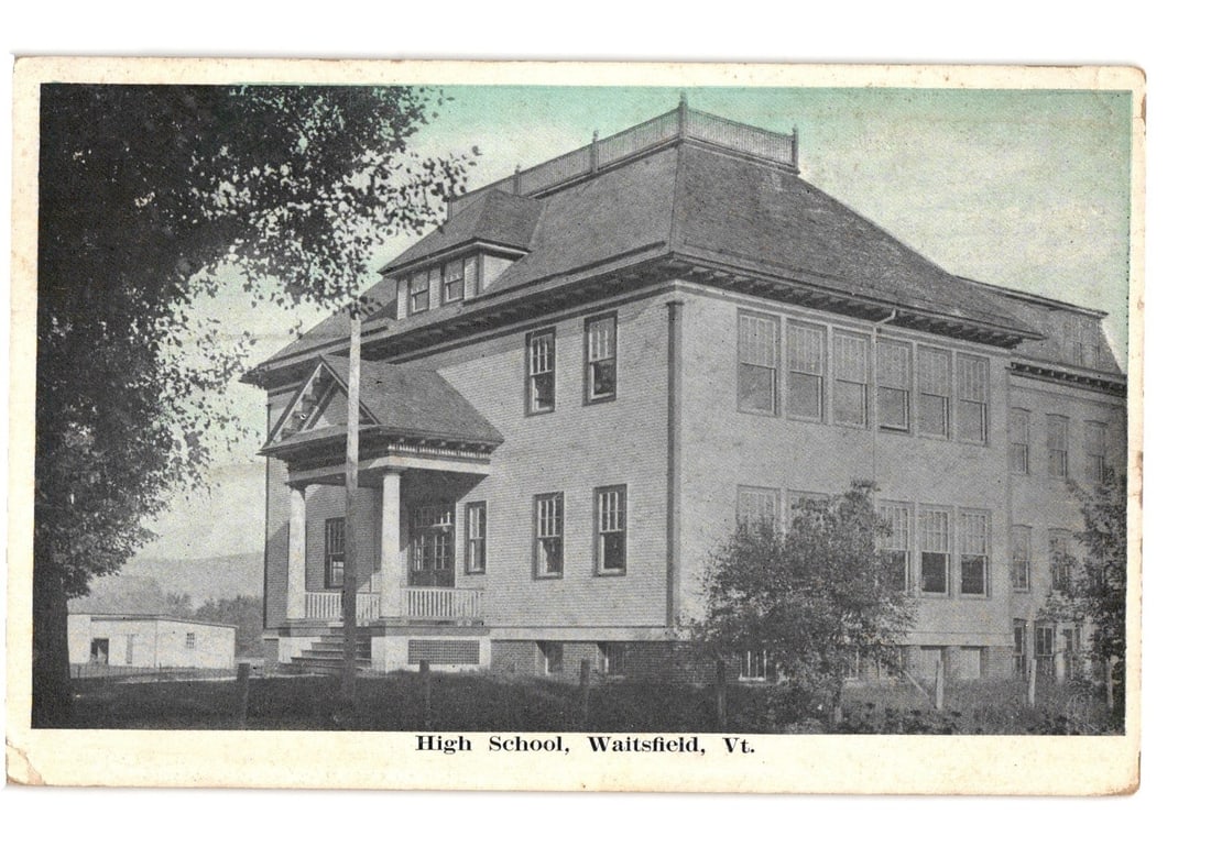 1924 Waitsfield, Vermont High School Building postcard, architectural view, early 20th century.: A large, multi-story building, likely a high school, constructed of clapboard siding with a prominent dark-colored gambrel or mansard-style roof. The building features numerous windows, including mult