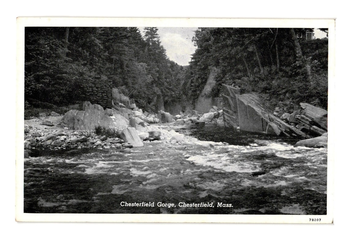 Scenic Chesterfield Gorge Postcard, Westfield River, Massachusetts, Old Bridge Abutment Visible: A black and white photographic postcard captures Chesterfield Gorge, depicting a river flowing over a rocky bed with turbulent water. Steep, densely forested hills rise on both sides. On the right ban