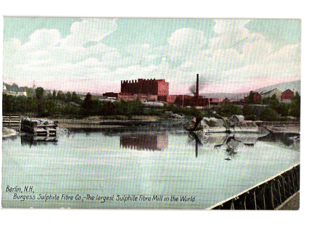 Berlin, N.H. Burgess Sulphite Fibre Co. Mill, "Largest Sulphite Fibre Mill in the World" postcard.: A panoramic view of the Burgess Sulphite Fibre Company mill complex in Berlin, New Hampshire. The large brick industrial buildings, featuring multiple towers and a prominent smokestack emitting smoke,