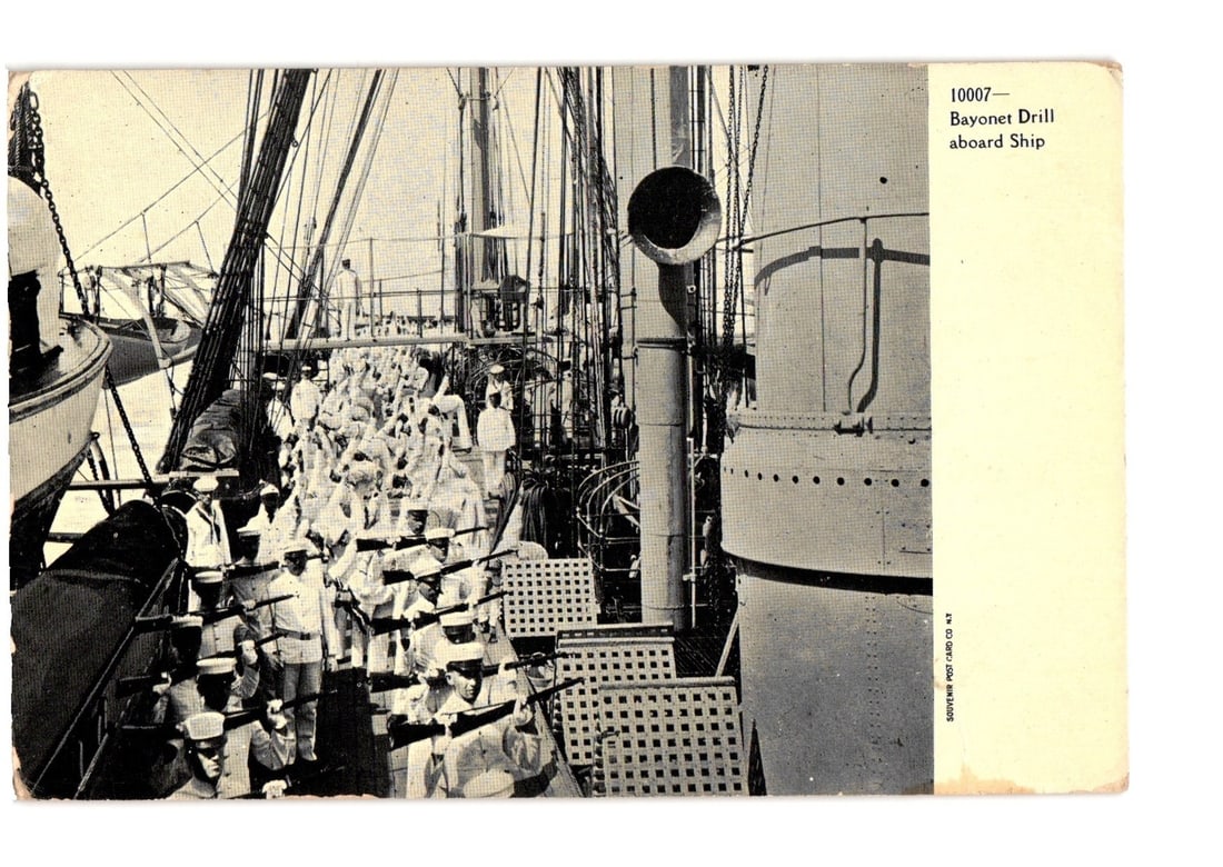 Early 20th Century Naval Bayonet Drill on a Ship, Souvenir Post Card Co. NY Postcard: A group of sailors or soldiers, dressed in white uniforms and hats, performs a bayonet drill on the deck of a large ship. They stand in organized rows, holding rifles with fixed bayonets in a prepared