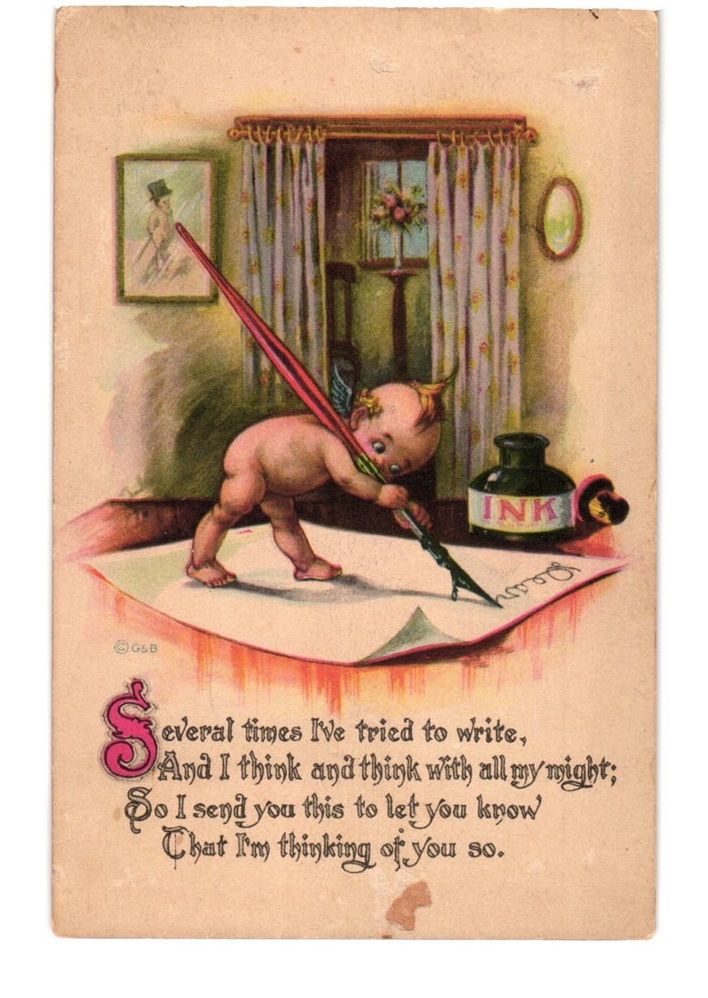 Sentiment postcard with cherub writing letter from inkwell, postmarked Caldwell, NJ, 1913.: A cherubic figure, adorned with small wings, kneels on a large piece of paper, actively writing with a prominent red quill pen. The quill's nib is dipped into an inkwell labeled 'INK'. The scene is se