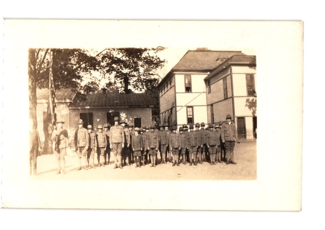 Early 20th Century Real Photo postcard of Military Personnel Group in front of Buildings (1 of 2)