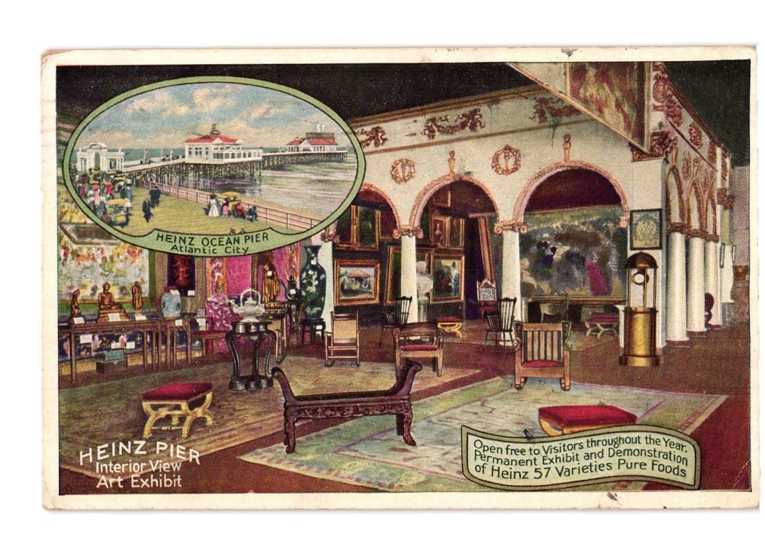 1916 Atlantic City, New Jersey Heinz Pier Art Exhibit interior view and Ocean Pier postcard.: A chromolithograph postcard displays the interior of the Heinz Pier Art Exhibit. The spacious room features arched alcoves, columns, and walls covered with framed paintings. Furniture including chairs