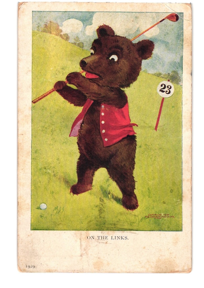 Early 20th Century Chromolithograph Postcard of a Bear Playing Golf on the Links, c. 1909: A brown bear, anthropomorphized and wearing a red vest, is depicted in the act of swinging a golf club. A white golf ball rests on the grass foreground. A flag with the number "23" marks a hole in the