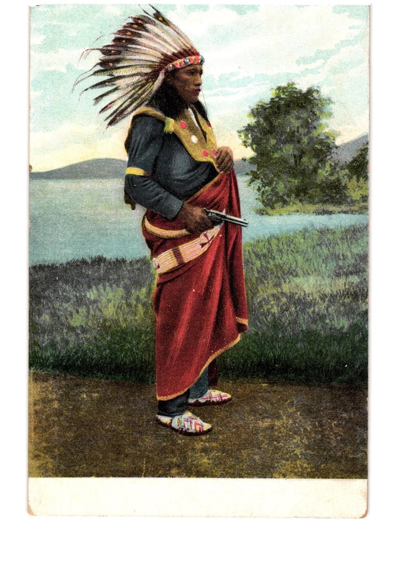 Chromolithograph postcard of a Native American man in headdress with pistol, early 20th century.: A Native American man, depicted in profile and facing right, stands against an outdoor landscape. He wears a prominent feathered headdress, a dark long-sleeved shirt with light armbands, a red skirt-l