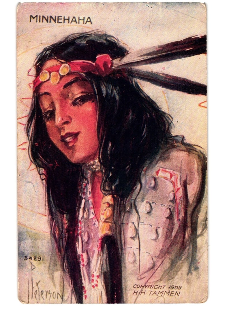 Minnehaha Native American Woman Portrait Color Lithograph postcard, Copyright 1909, Postmarked 1914: A color lithograph postcard depicting a close-up portrait of a woman, rendered as a Native American figure. She has long dark hair and wears a red headband adorned with circular gold-toned ornaments. 