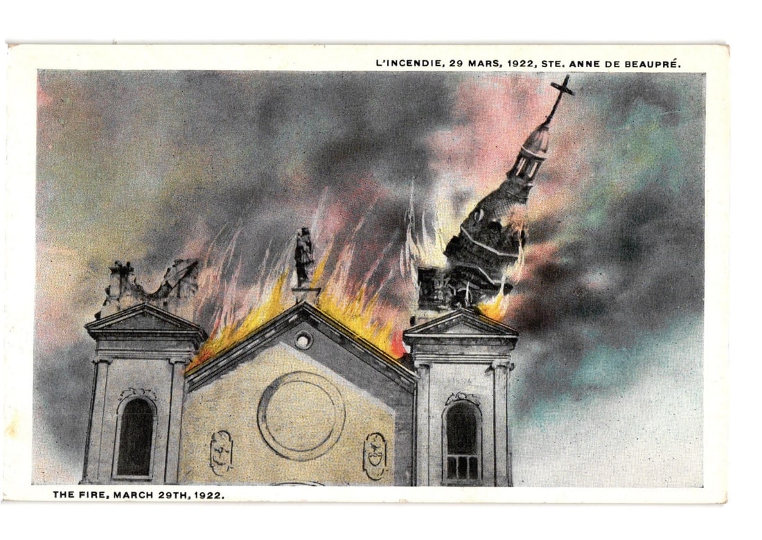 Ste. Anne de Beaupre Basilica Fire, March 29, 1922, Quebec Church Destruction postcard: The Basilica of Sainte-Anne-de-Beaupre is depicted engulfed in flames. The church's facade, with its twin towers, is visible, but the right spire is heavily damaged, leaning precariously to the right,