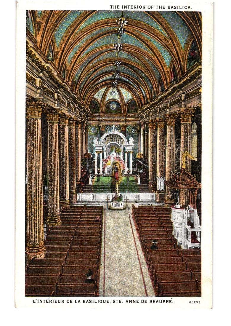 Interior View of the Basilica at Sainte Anne de Beaupre, Quebec, architectural postcard.: An elevated, straight-on view captures the elaborate interior of a basilica, extending down a long nave towards the ornate altar. The nave is lined with rows of dark wooden pews and massive fluted col