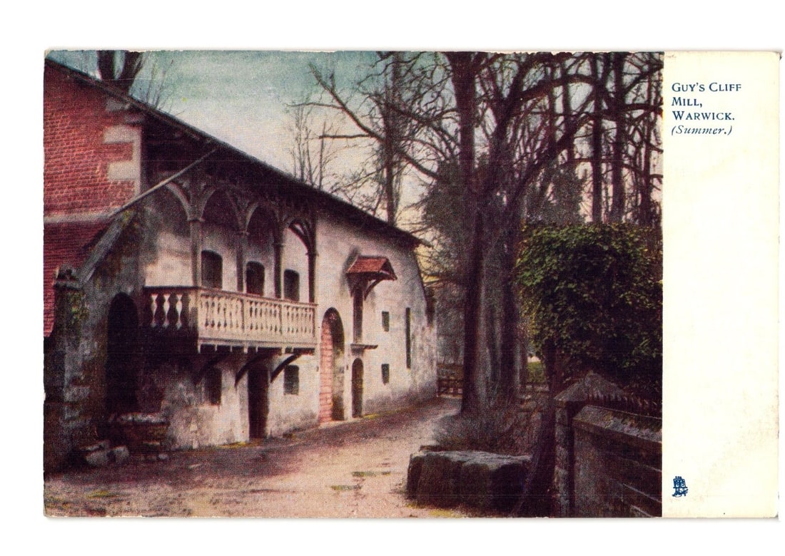 Guy's Cliff Mill, Warwick, England, summer view, early 20th century chromolithograph postcard: A chromolithograph postcard depicts Guy's Cliff Mill in Warwick, England, in a summer scene. The central subject is a multi-story stone building with a red tile roof, exposed timber framing, an ornate