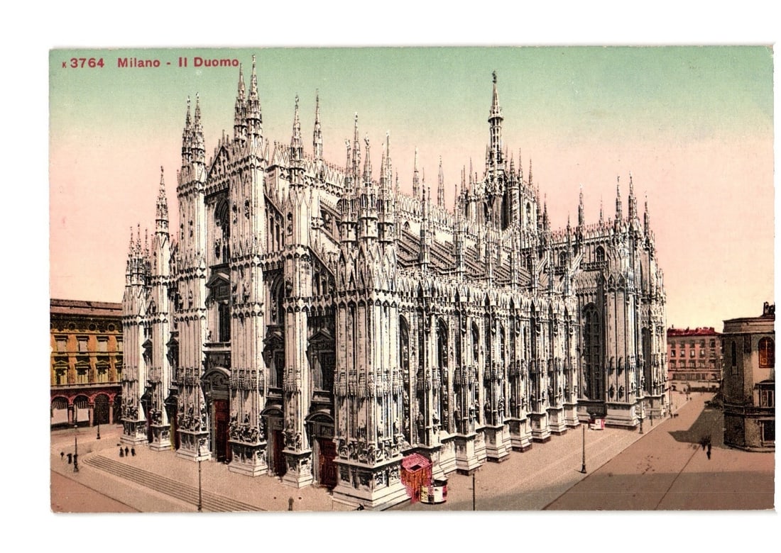Chromolithograph postcard depicting the Milan Cathedral, Il Duomo, a grand Gothic edifice in Italy.: The Milan Cathedral (Il Duomo) is depicted in a wide, slightly elevated perspective, showcasing its elaborate Gothic architecture. The grand edifice is characterized by numerous spires, pinnacles, and