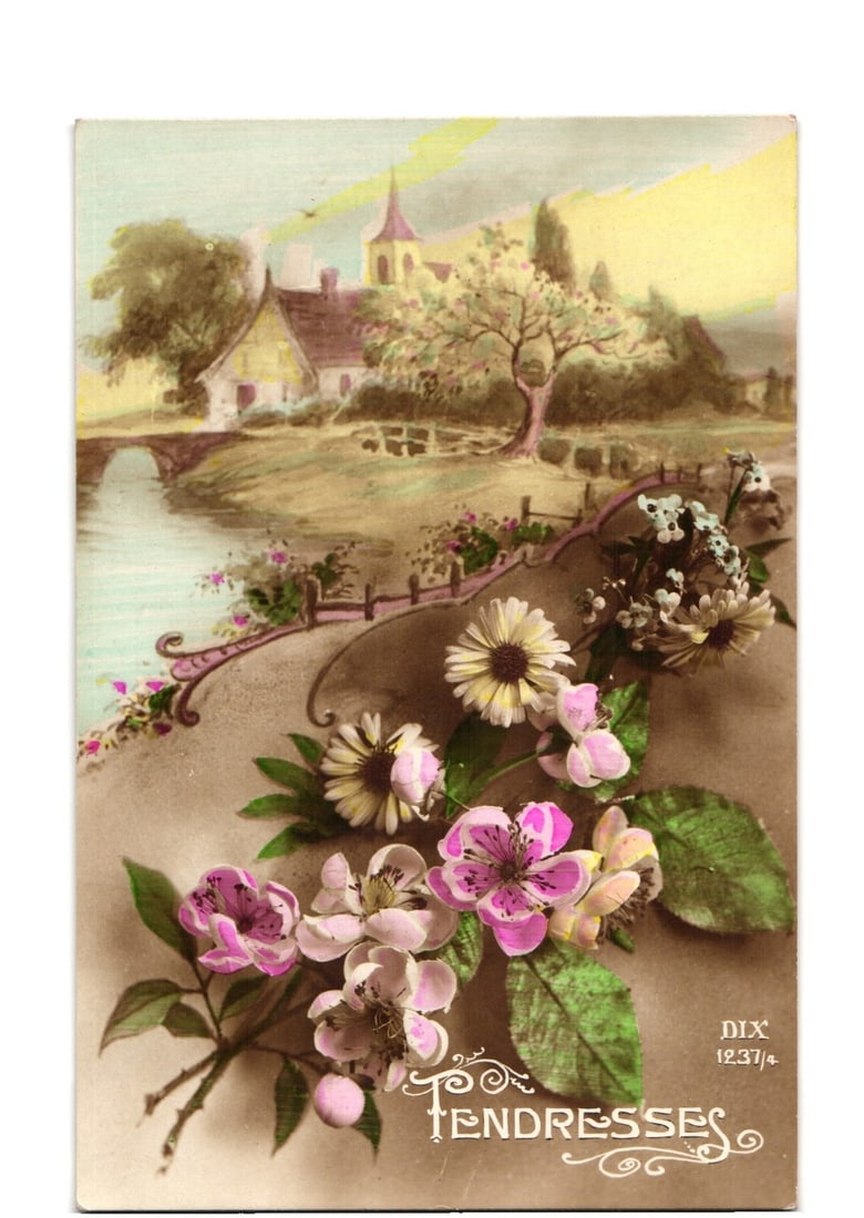 Floral Vignette and Village Scene Postcard, Early 20th Century European Chromolithograph: A vibrant chromolithograph depicts a detailed floral arrangement in the foreground, featuring clusters of pink, white, and yellow daisy-like flowers with green leaves. These flowers are arranged along