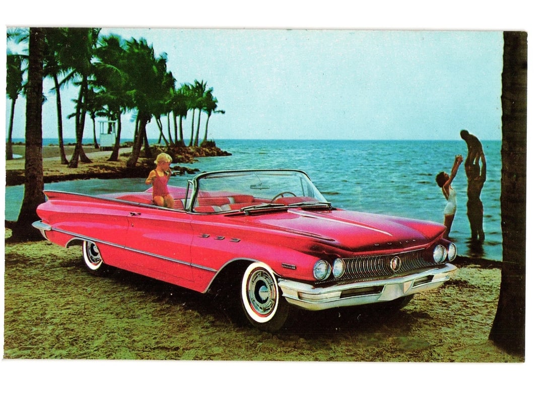 1959 Buick Invicta Convertible on Tropical Beach with People, Advertising Promotional Postcard: A vibrant color photograph depicts a 1959 Buick Invicta convertible, finished in "Magic-Mirror Tampico Red," parked on a sandy beach. The car is angled toward the viewer, with its right rear wheel par