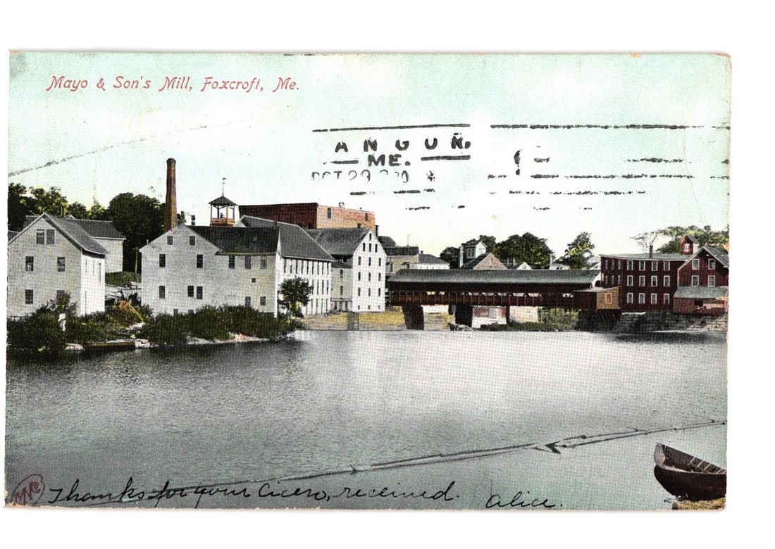 Mayo & Son's Mill and Covered Bridge in Foxcroft, Maine, Postcard, Postmarked October 23, 1905.: A view of Mayo & Son's Mill complex and a covered bridge spanning a body of water in Foxcroft, Maine. Several multi-story white buildings, characteristic of industrial architecture, are visible on the