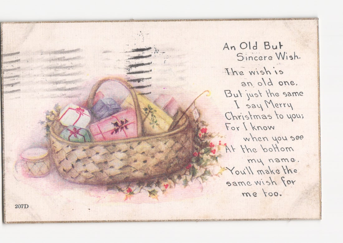Early 20th-Century 1921 Christmas postcard: Illustrated Basket of Gifts and Holiday Poem: A color illustration depicts a woven basket filled with various wrapped gifts, adorned with holly and red berries. A small light-colored mug is visible to the left. The scene is set against a light ba