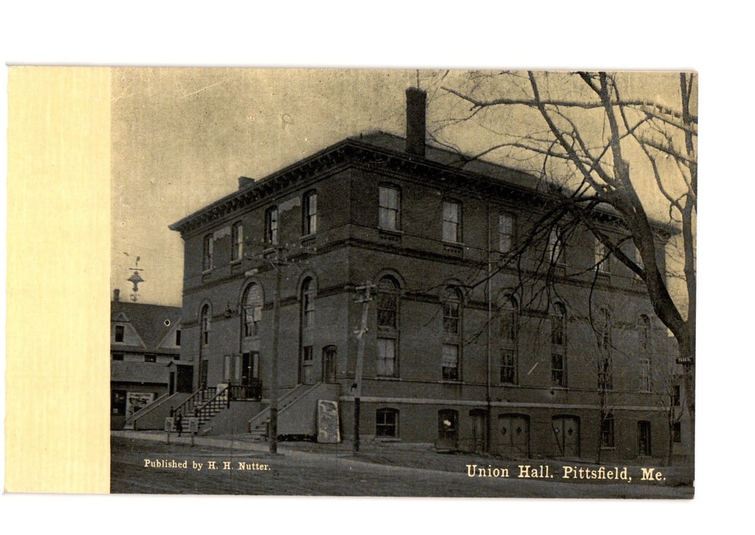 Historic Union Hall Building, Pittsfield, Maine, Early 20th Century Architectural View Postcard: A sepia-toned photographic postcard depicts the Union Hall building in Pittsfield, Maine. The large, multi-story brick structure features a prominent chimney, a decorative cornice, and multiple window