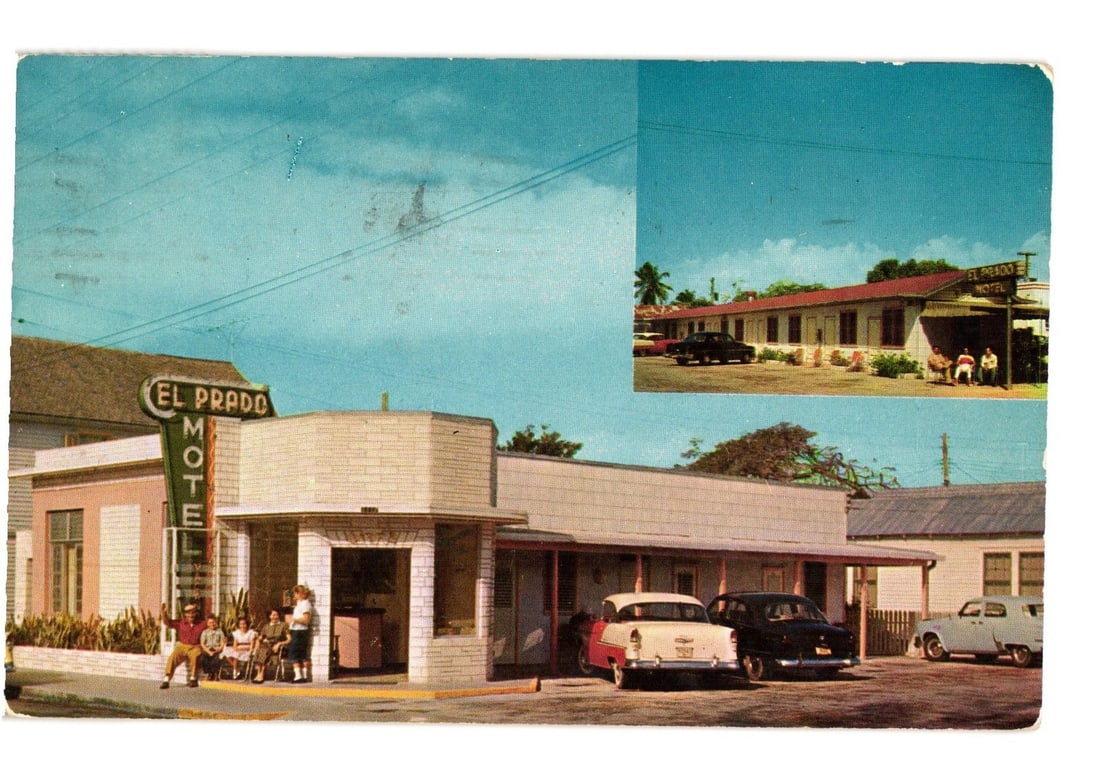 El Prado Motel exterior with parked cars and seated patrons, Key West, Florida, 1957 postcard. (1 of 2)