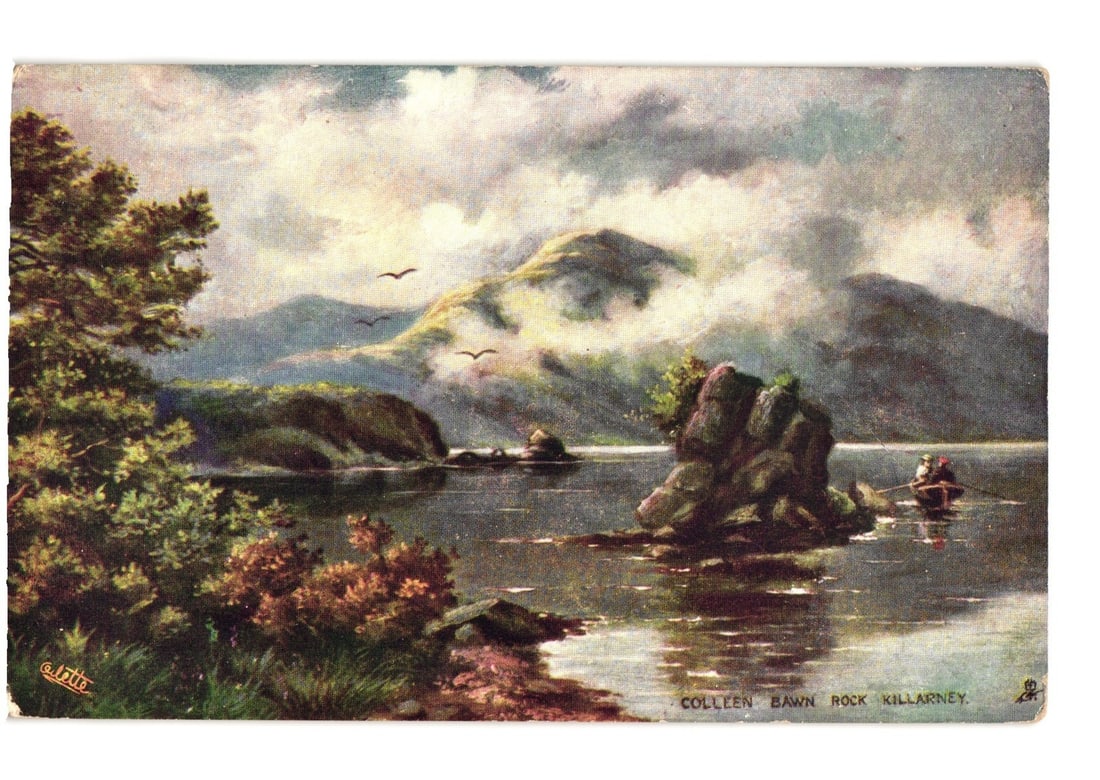 Chromolithograph Postcard of Colleen Bawn Rock, Middle Lake, Killarney, Ireland, Early 20th Century: A chromolithograph depicting Colleen Bawn Rock on the Middle Lake in Killarney, Ireland. Lush green foliage and trees frame the left foreground, leading to the lake. The large rock formation, Colleen 