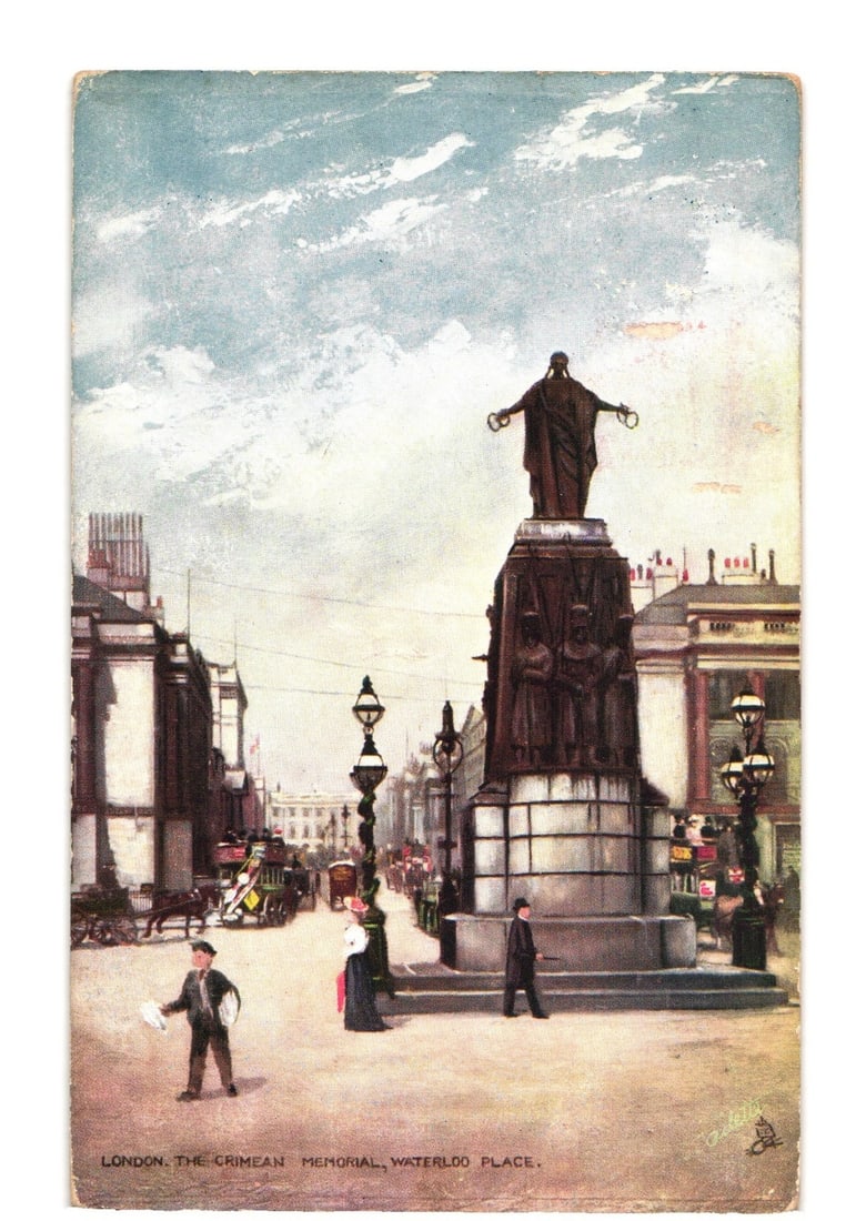 Vintage postcard of London's Crimean Memorial, Waterloo Place, with pedestrians and horse-drawn: The Crimean Memorial in Waterloo Place, London, is depicted from a street-level perspective. The central monumental group features a bronze figure at its apex holding laurel wreaths, with three guards