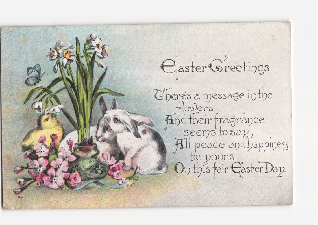 Easter Greetings Postcard with Bunnies, Chick, and Flowers, Postmarked New York 1920: An illustration depicts two white rabbits and a yellow chick gathered among flowers. White daffodils in a green vase are prominent on the left, flanked by pink blossoms. A butterfly hovers near the da