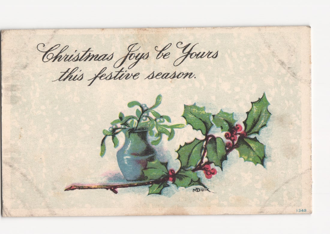 Christmas Holiday Mistletoe and Holly Botanical Illustration Postcard, Early 20th Century: A chromolithograph depicting a still life of holiday botanicals. A small blue vase holds a sprig of mistletoe, resting on a brown branch extending across the lower portion of the image. Adjacent to th