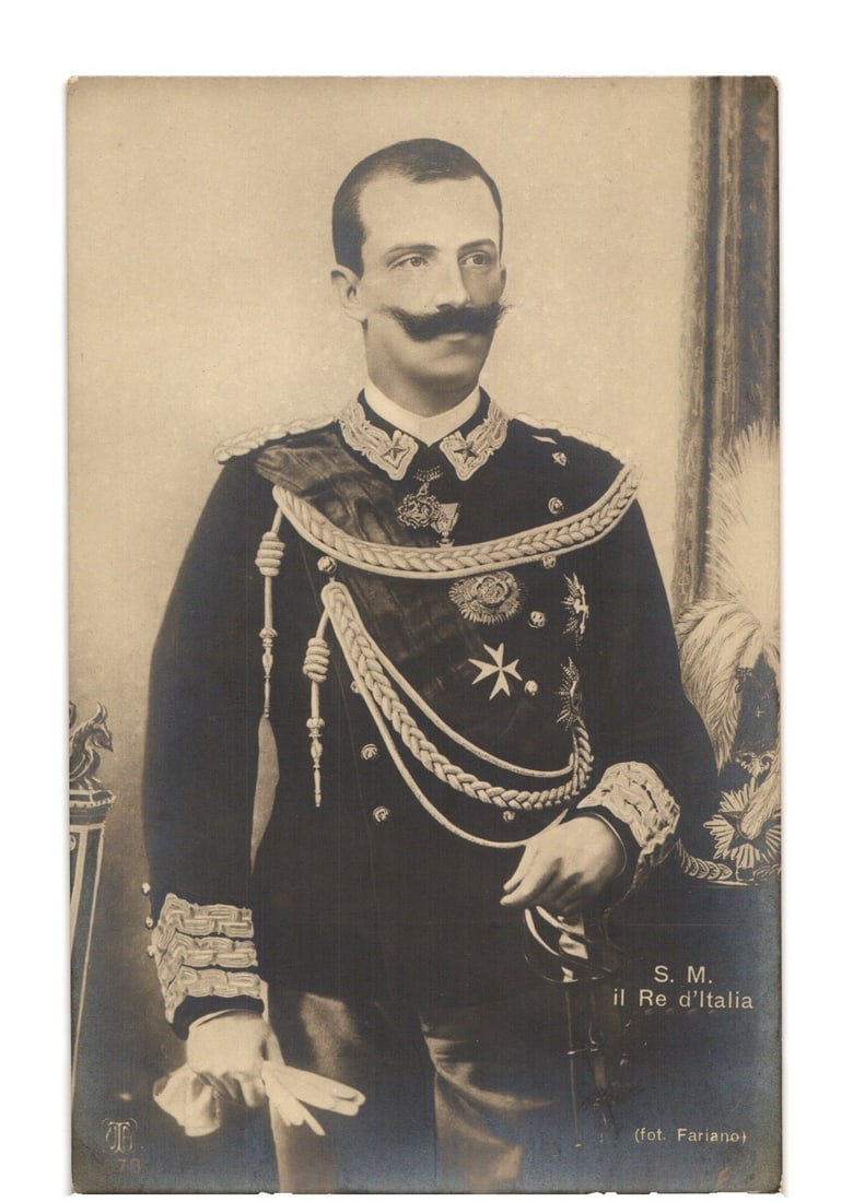 Early 20th Century Postcard: King of Italy in Ornate Military Uniform, Studio Portrait: A three-quarter portrait of a man, identified as "His Majesty, the King of Italy," standing in a dark, ornate military uniform. The uniform features extensive gold braiding, epaulets, a sash across hi