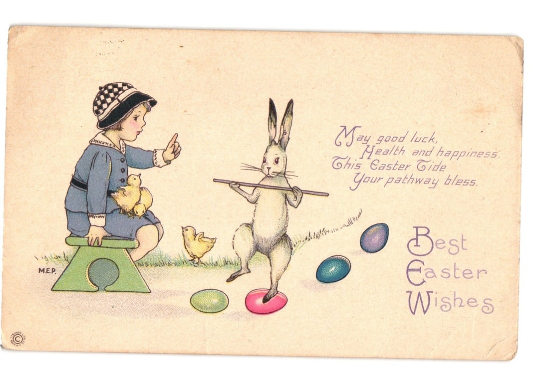 Illustrated Early 20th Century Easter postcard: Child, Balancing Rabbit, Chicks, and Eggs.: An illustration depicts a young child in a blue suit and checkered hat seated on a green stool, gesturing towards a white rabbit. Two yellow chicks are present, one on the stool with the child, the ot