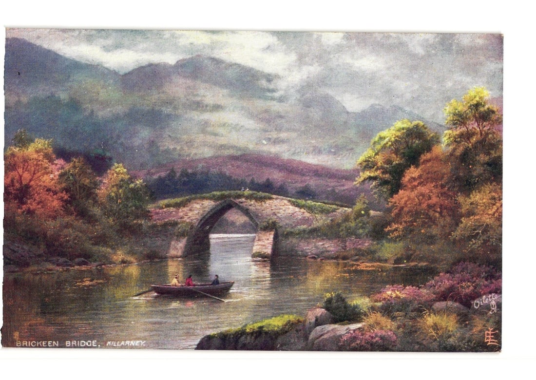 Brickeen Bridge, Killarney, Ireland: Picturesque Chromolithograph Postcard with Rowboat: A chromolithograph postcard shows Brickeen Bridge over water in Killarney. A stone arch bridge spans a channel, with a rowboat carrying three figures passing beneath. Densely forested banks exhibit au