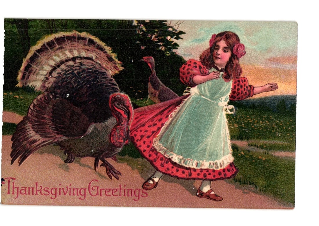 Thanksgiving Greetings postcard depicting a young girl with a large turkey, early 20th century.: A young girl with light brown hair, adorned with two pink flowers, is depicted wearing a light blue dress with a white apron and red polka-dotted trim on her sleeves and skirt. She interacts with a la