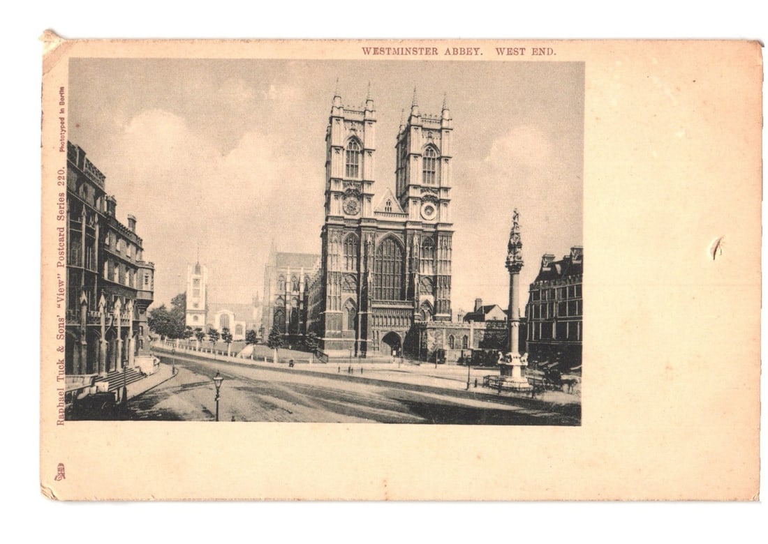 Early 20th C. Westminster Abbey, West End, London, sepia-tone undivided back postcard: A sepia-tone phototyped image depicts Westminster Abbey from a slightly elevated, three-quarter perspective. The iconic Gothic structure, featuring two grand towers and a visible clock face, dominates