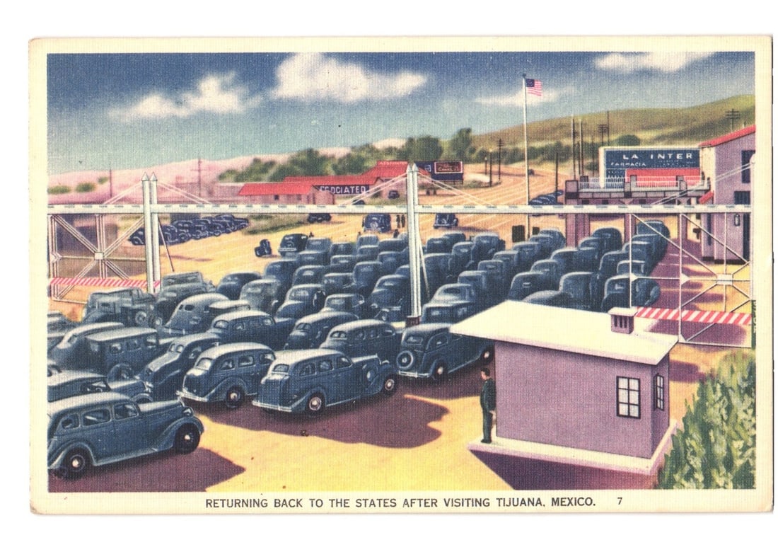Vintage US-Mexico Border Crossing, Tijuana, Mexico, 1930s-1940s Era Colorized Postcard: A busy border crossing scene depicts numerous automobiles, likely from the 1930s-1940s, queued up at a checkpoint. The image is an elevated view showing multiple lanes of cars beneath a white, bridge-