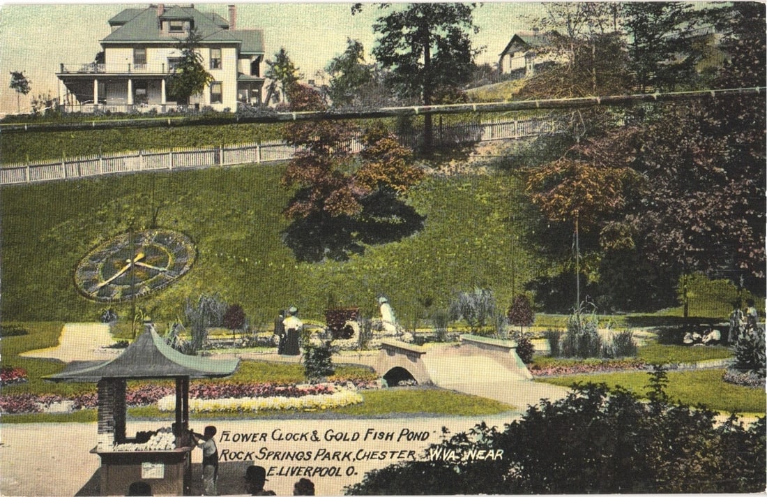 Early 20th Century postcard showing Rock Springs Park Flower Clock and Gold Fish Pond, Chester, West: A scenic view of Rock Springs Park with a large floral clock embedded into a grassy hillside. The clock features Roman numerals and visible hands. In the foreground, a pavilion with a distinctive roof