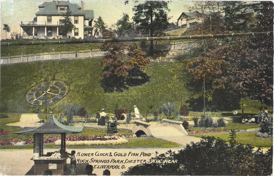 Rock Springs Park Flower Clock and Gold Fish Pond postcard, Chester, W.Va. & E. Liverpool, O.: Park scene features the Flower Clock and Gold Fish Pond at Rock Springs Park. A large flower clock with Roman numerals and hands is set into a grassy hillside. Trees and foliage frame the scene. A gaz