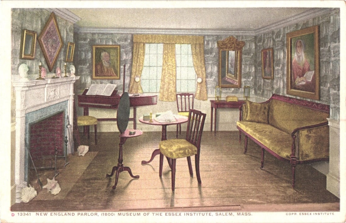 New England Parlor (1800) Interior Display, Museum of the Essex Institute, Salem, Mass. postcard: A view of a New England parlor, furnished in a style suggesting the year 1800, part of the Museum of the Essex Institute in Salem, Massachusetts. The room features a settee with gold upholstery, a squ