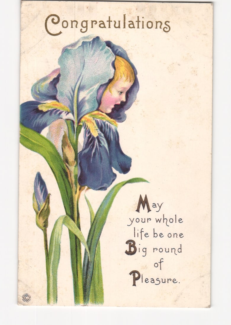 Illustrative postcard with child's face in large iris flower, bearing 'Congratulations' text.: Please review the photos carefully for additional condition details. Note that scans may appear slightly darker or lighter than the item's true appearance, and minor scanning artifacts may be visible.