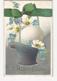 Vintage Easter postcard featuring eggs in a basket with flowers and green ribbon, postmarked 1920.