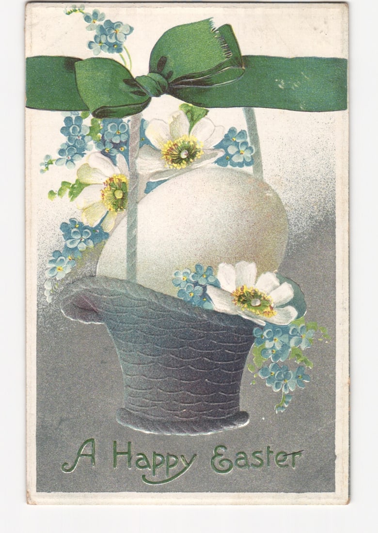 Vintage Easter postcard featuring eggs in a basket with flowers and green ribbon, postmarked 1920.: Please review the photos carefully for additional condition details. Note that scans may appear slightly darker or lighter than the item's true appearance, and minor scanning artifacts may be visible.