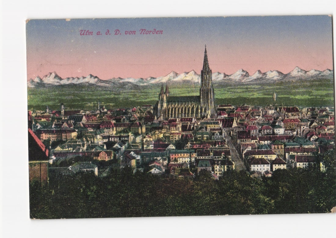 Early 20th Century Lithographic postcard showing Ulm Cathedral and city view with distant Alps.: Please review the photos carefully for additional condition details. Note that scans may appear slightly darker or lighter than the item's true appearance, and minor scanning artifacts may be visible.