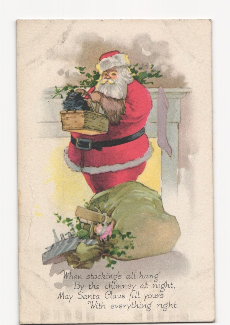 Early 20th Century Chromolithograph Postcard of Santa Claus Filling Stockings by a Fireplace (1 of 2)