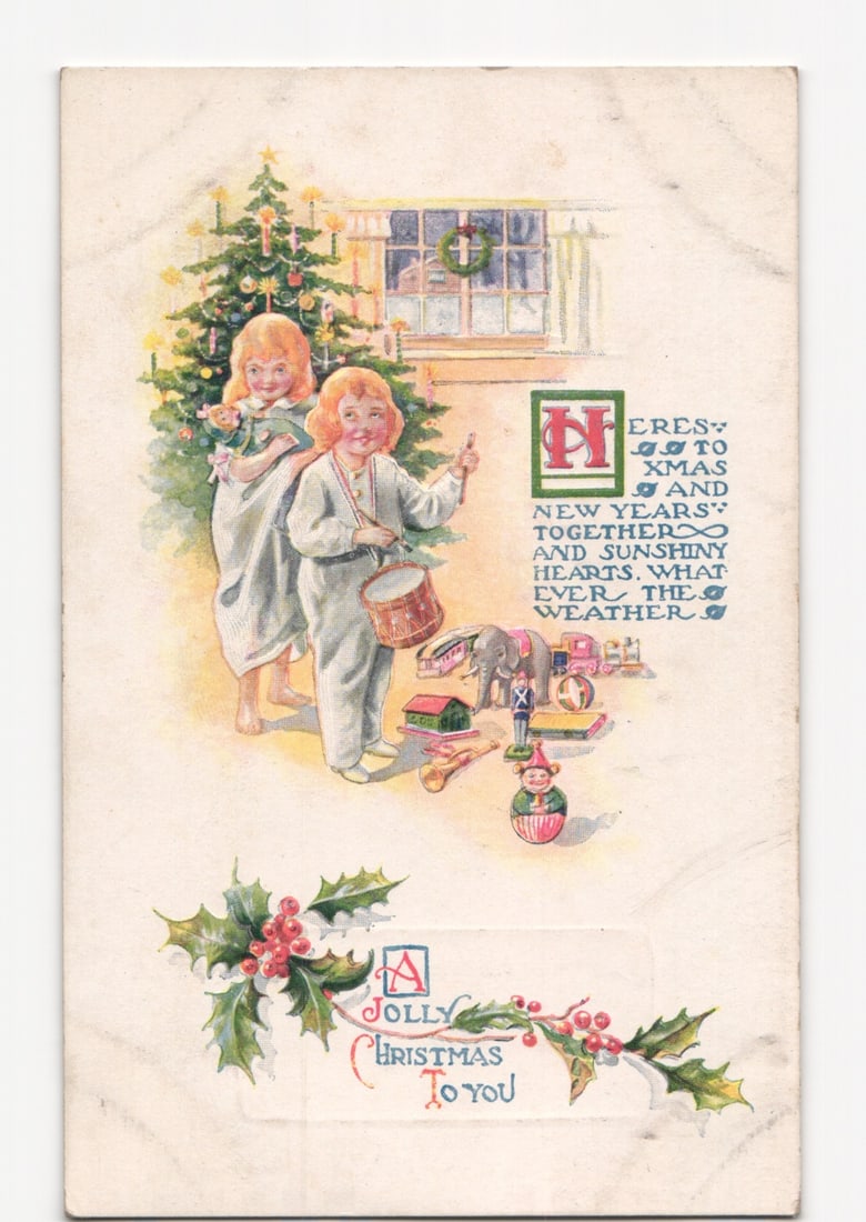 1921 American holiday postcard, two children with Christmas tree, toys, and holly (1 of 2)