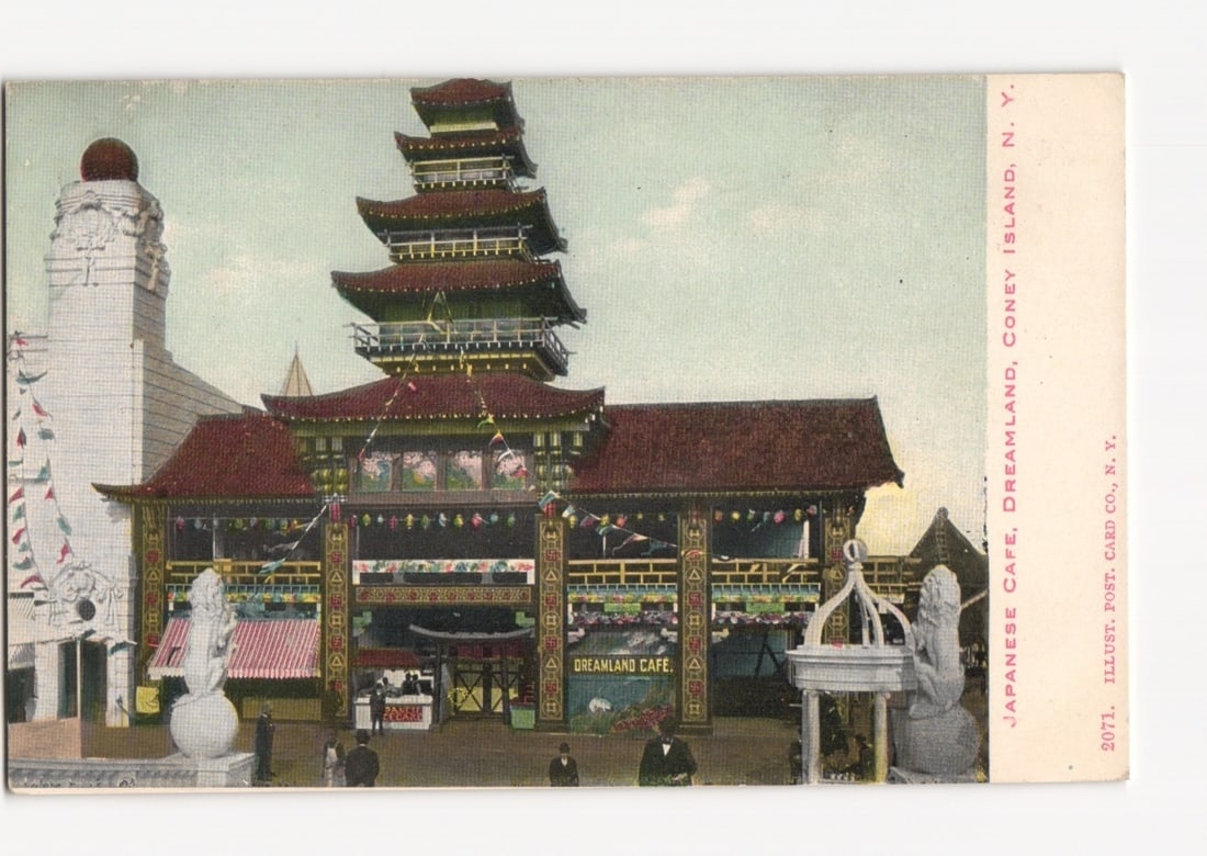 Japanese Cafe at Dreamland, Coney Island, New York, early 20th-century amusement park postcard: A multi-tiered pagoda-style building with red roofs forms the central focus of the front image, flanked by a white domed tower on the left. A large entrance archway, adorned with flags and banners, fe