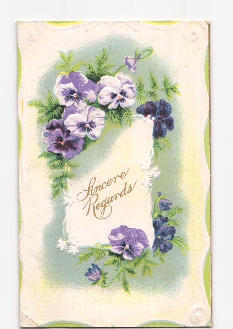 Pansy Floral Design 'Sincere Regards' Greeting Postcard, German Print, Early 20th Century: A vertical chromolithograph featuring a floral arrangement of pansies and foliage. The central area is a light blue vignette, framed by an oval of purple, white, and dark purple pansies with green lea