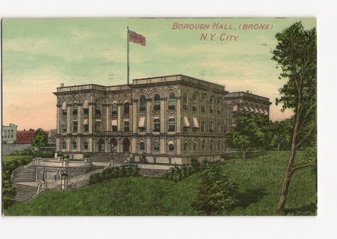 Classical Borough Hall (Bronx) in New York City with American Flag, early 20th-century postcard: A classical-style public building, likely Borough Hall in the Bronx, New York City, stands prominently on a grassy incline. The multi-story structure features numerous arched windows, columns, and a c