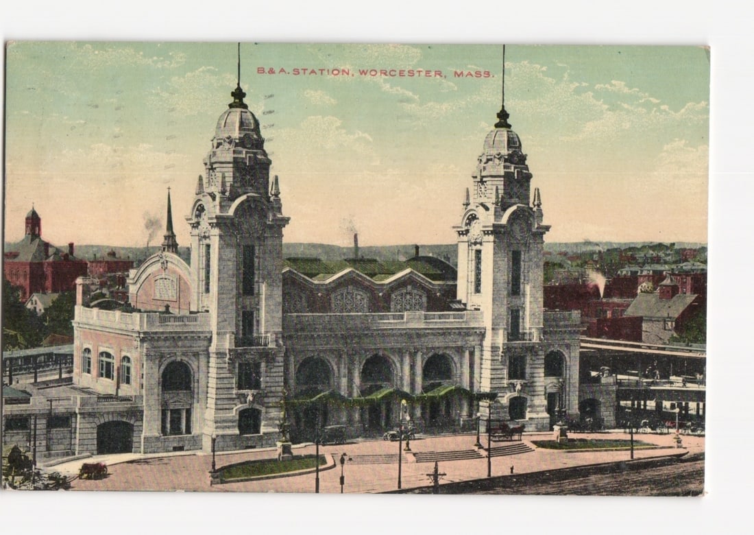Imposing B&A Station, Worcester, Massachusetts, Early 20th-Century American Architectural Postcard: The B&A Station in Worcester, Massachusetts, is depicted in a frontal, slightly angled view. The station is a grand, ornate architectural structure featuring two prominent towers with domed roofs. Cla
