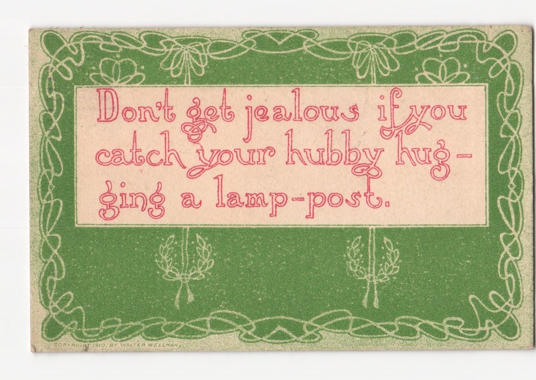 Humorous early 20th century postcard: 'Don't get jealous if you catch your hubby hugging a: A humorous message presented within a rectangular frame. The frame and surrounding background feature an Art Nouveau-inspired decorative design with intertwined organic lines and stylized bows, render